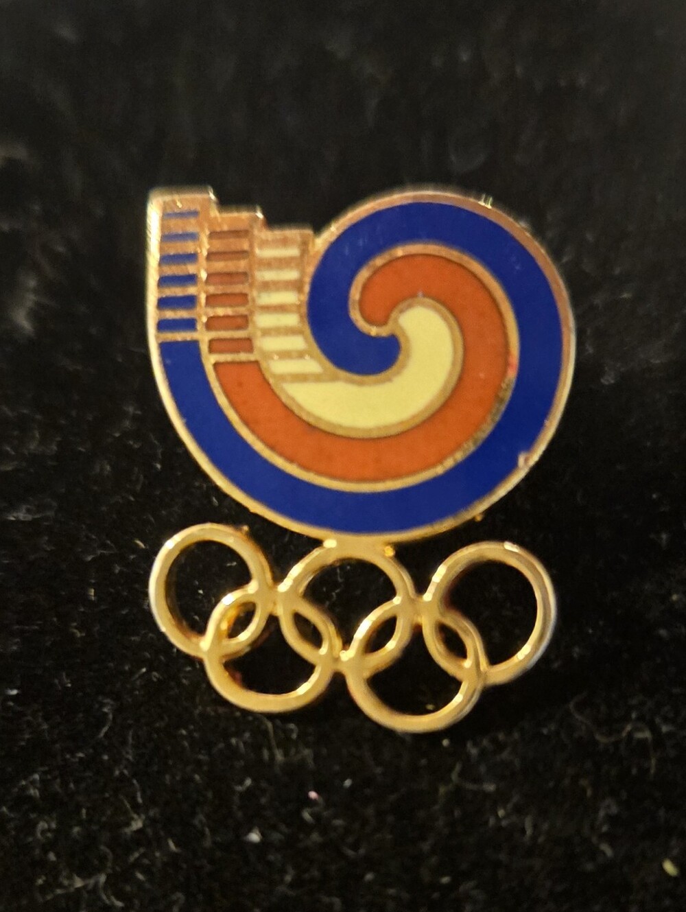 Vintage Olympic Pin with Colorful Spiral Emblem